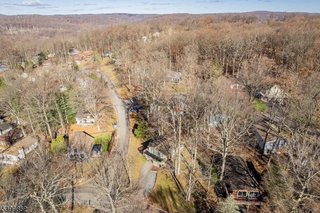 an aerial view of residential houses and outdoor space