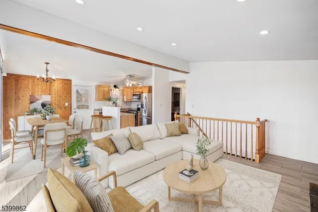 a living room with furniture and white walls