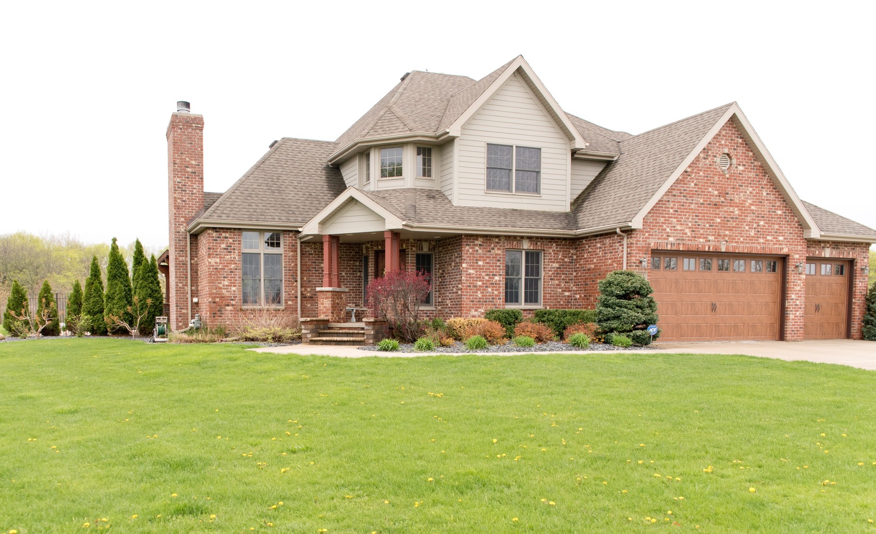 3773 Spring Run Lane Morris, IL 60450 - Photo 1 of 49 a front view of a house with a yard and garage