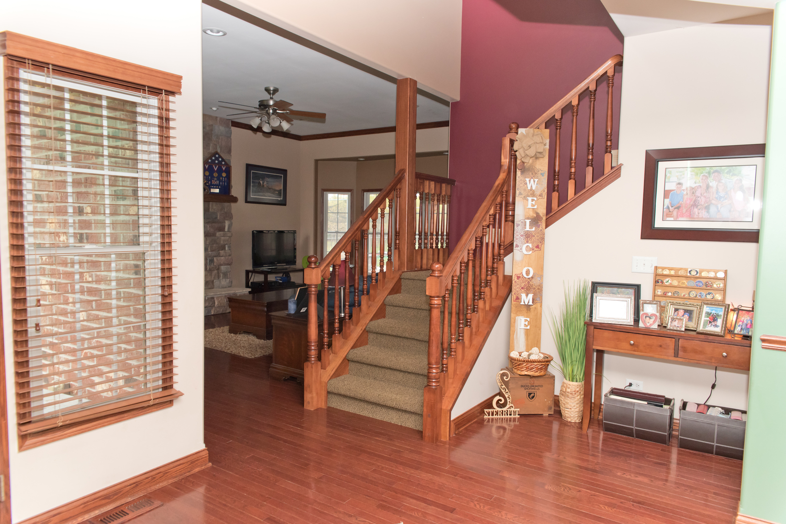 3773 Spring Run Lane Morris, IL 60450 - Photo 4 of 49 a view of a hallway with wooden floor and staircase