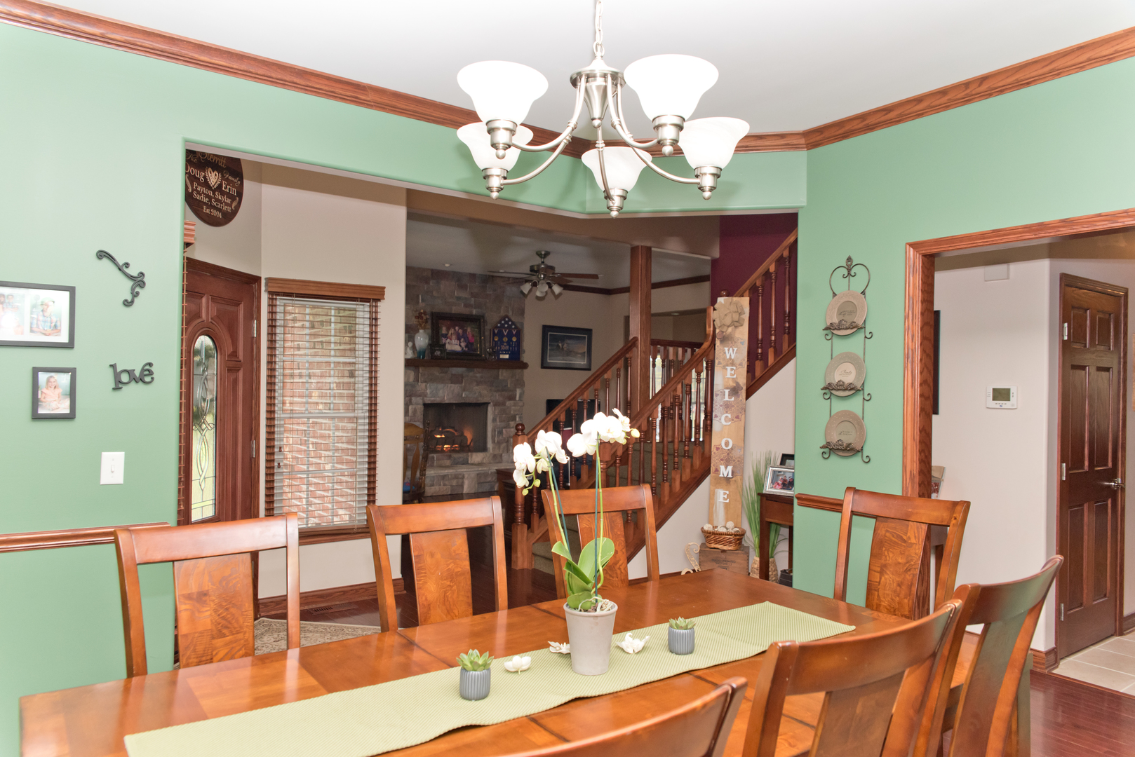 3773 Spring Run Lane Morris, IL 60450 - Photo 7 of 49 a view of a dining room with furniture a chandelier and wooden floor