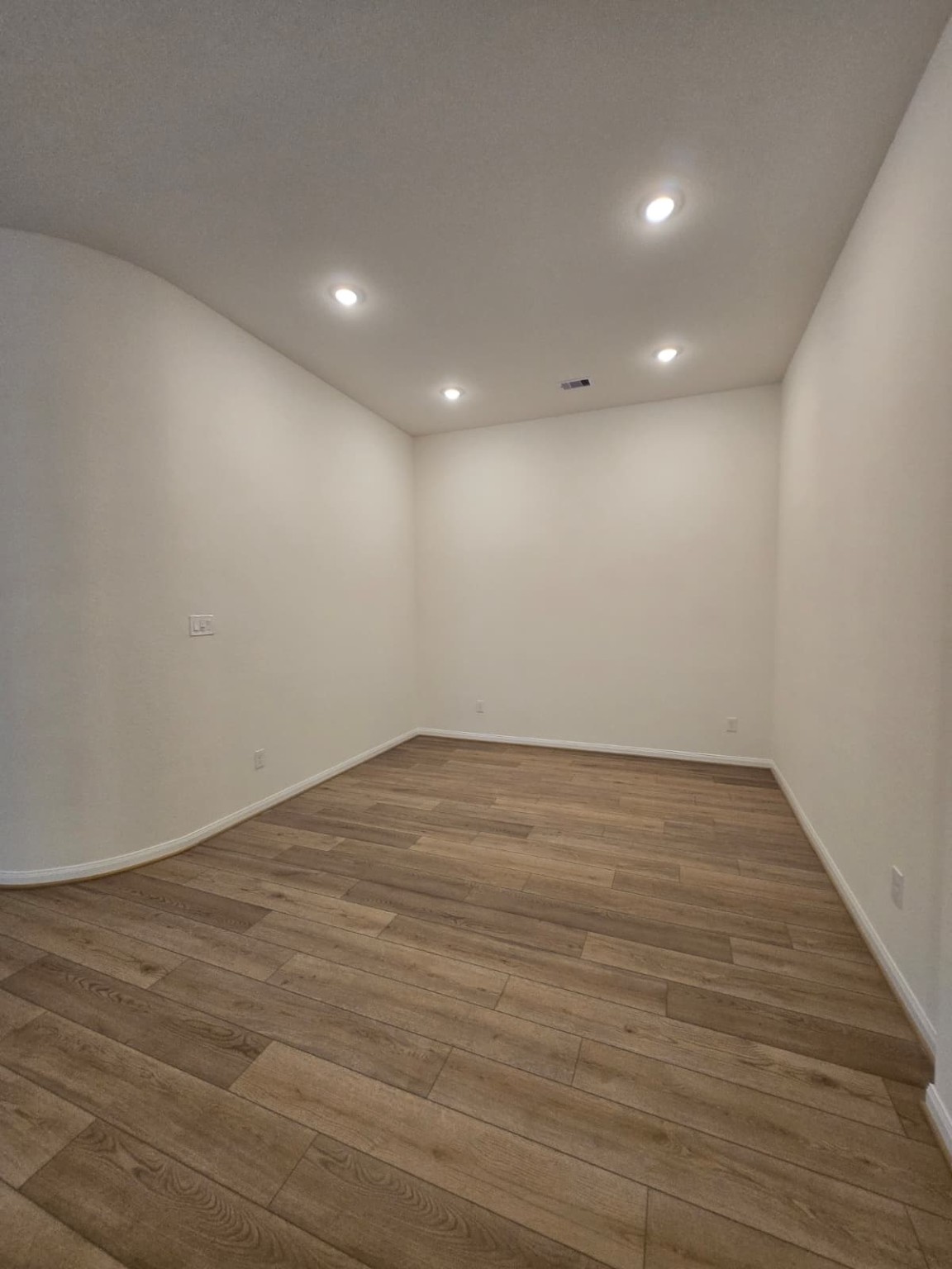 1420 Florecer Lane Magnolia, TX 77354 - Photo 11 of 36 an empty room with wooden floor and windows