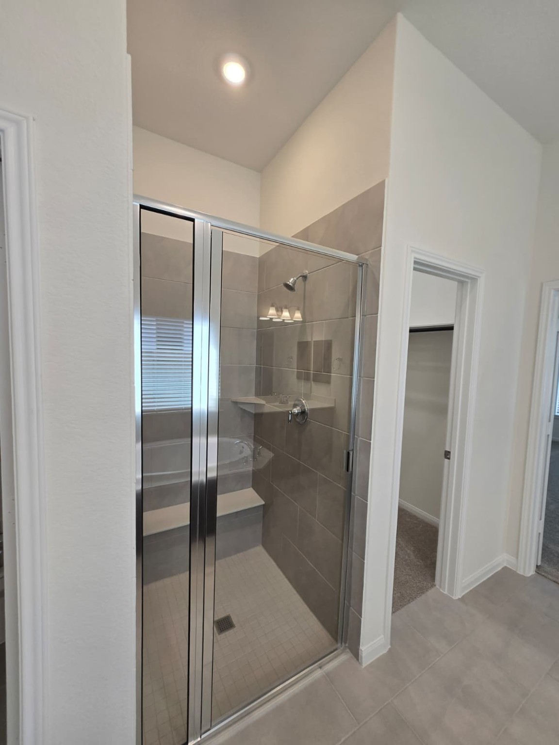 1420 Florecer Lane Magnolia, TX 77354 - Photo 14 of 36 a bathroom with a glass shower door
