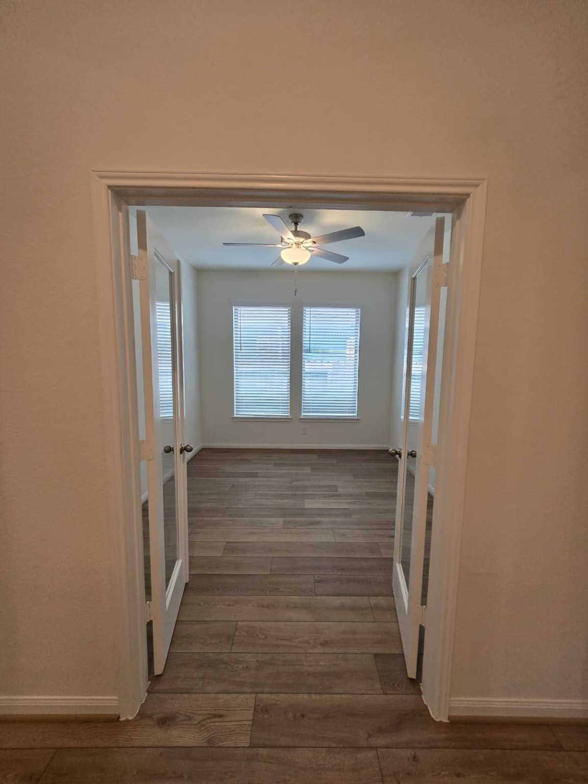 1420 Florecer Lane Magnolia, TX 77354 - Photo 20 of 36 a view of a hallway with wooden floor and front door