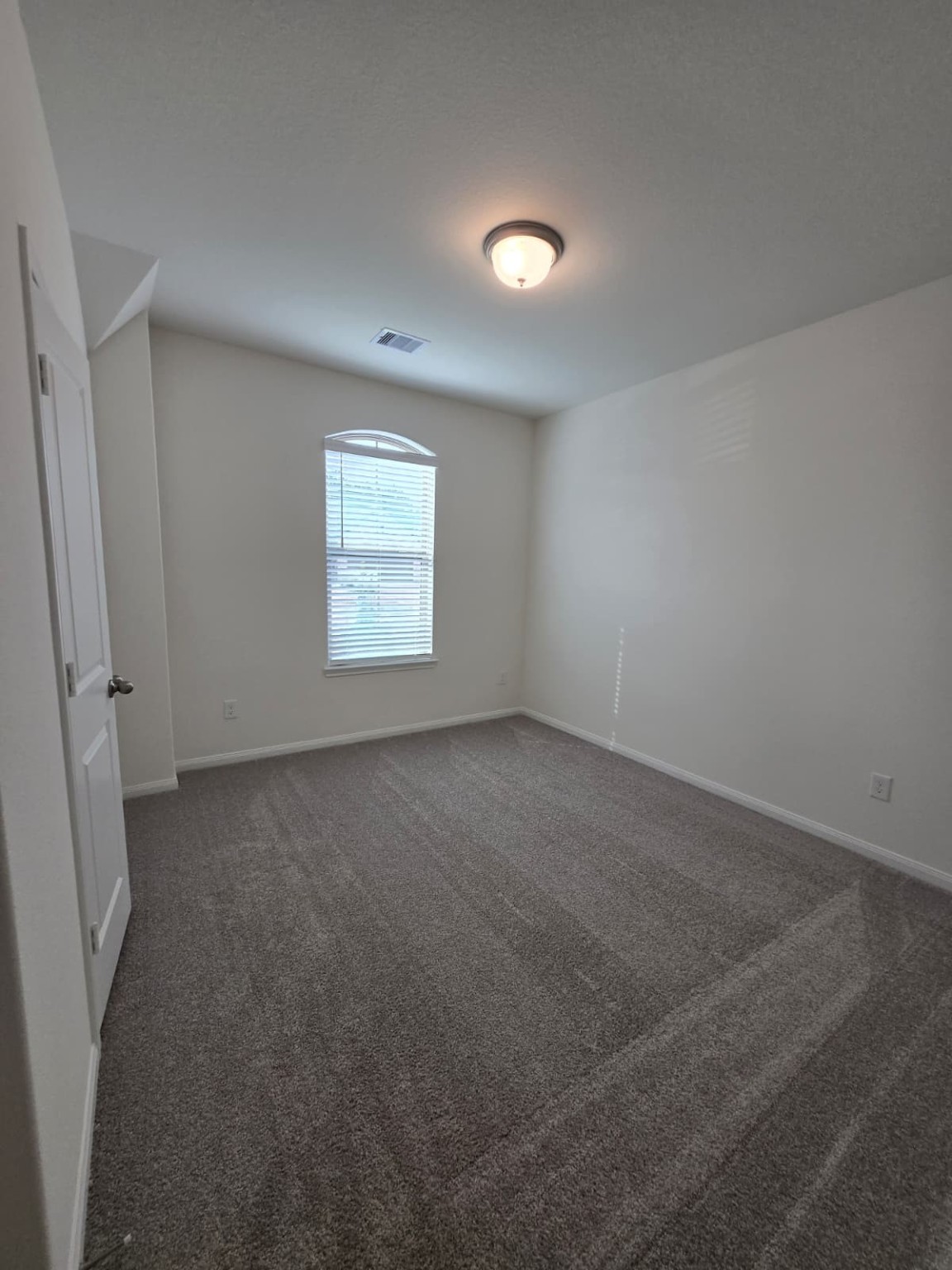 1420 Florecer Lane Magnolia, TX 77354 - Photo 22 of 36 an empty room with a window