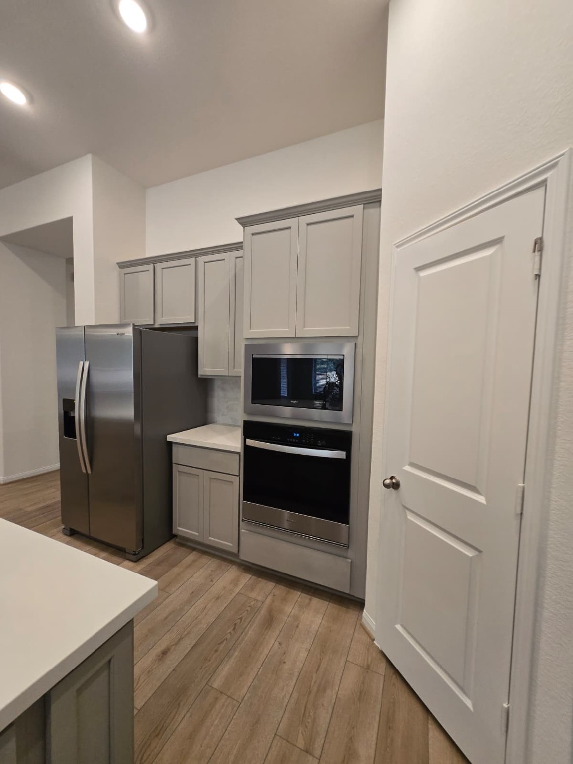 1420 Florecer Lane Magnolia, TX 77354 - Photo 9 of 36 a kitchen with a refrigerator stove and microwave