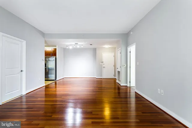 a kitchen with stainless steel appliances granite countertop a stove and a refrigerator