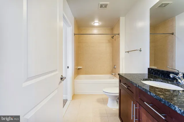 a view of living room with furniture and a fireplace