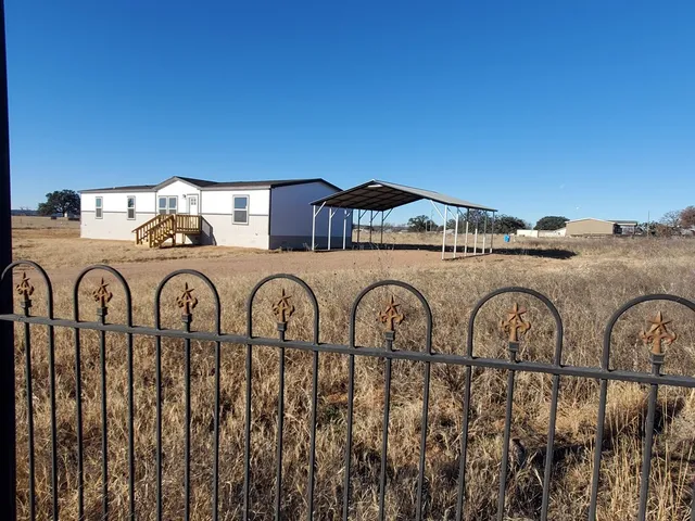 a house view with a garden space