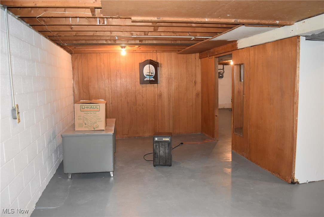 608 Gibbs Road Akron, OH 44312 - Photo 25 of 40 Basement featuring wood walls