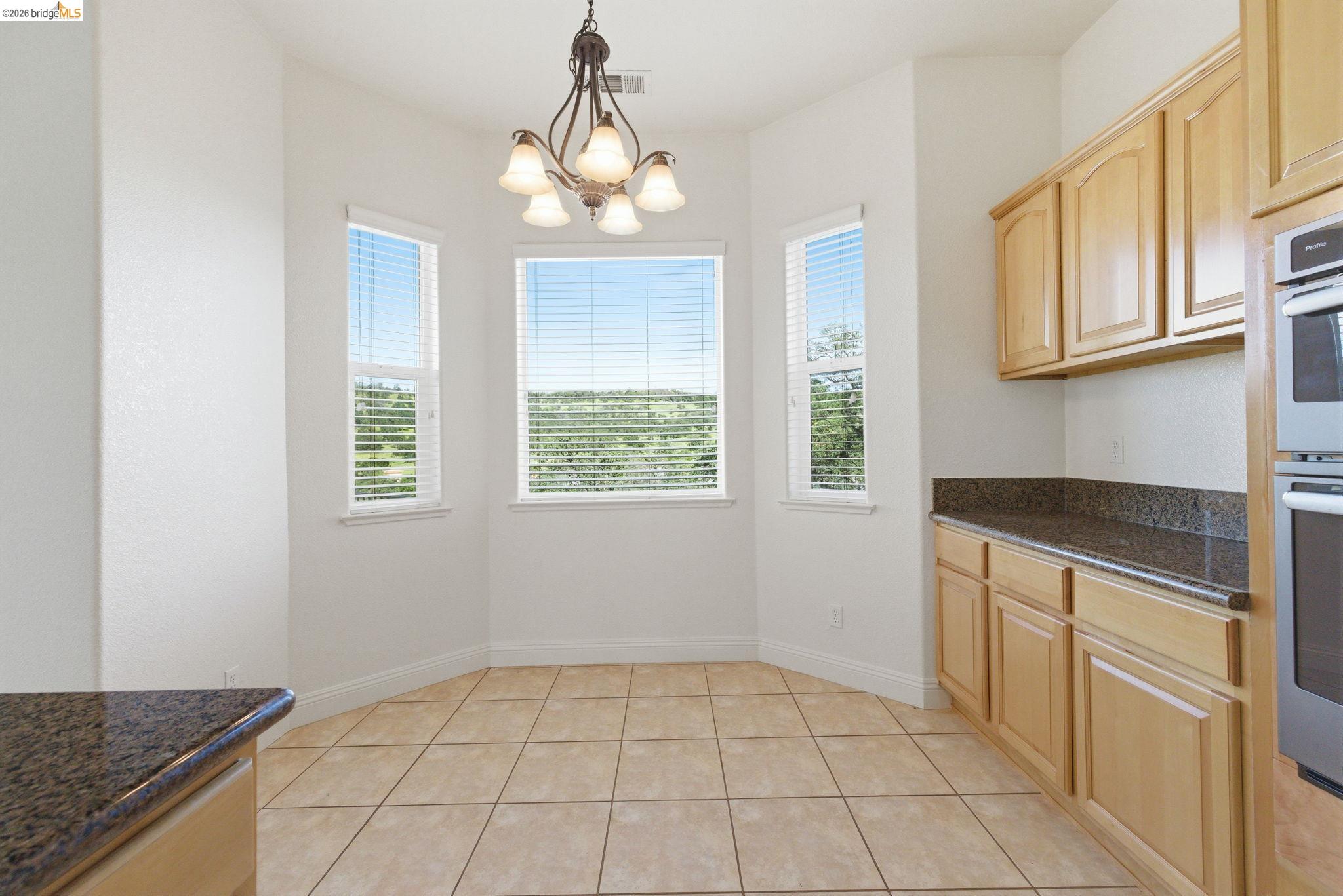 32 Apollo Lane Copperopolis, CA 95228 - Photo 19 of 58 Unfurnished dining area with light tile patterned floors and hanging lights