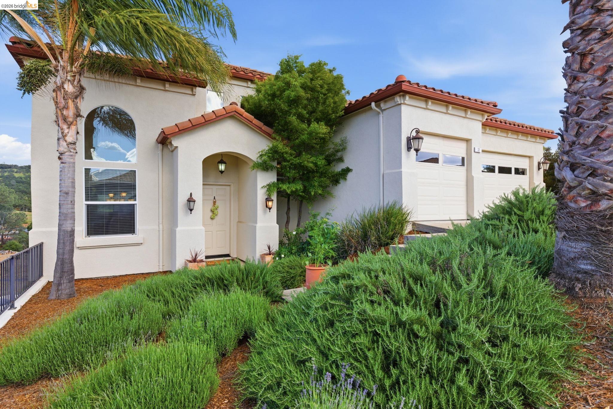 32 Apollo Lane Copperopolis, CA 95228 - Photo 2 of 58 Mediterranean / spanish home featuring stucco siding, an attached garage, and a tiled roof
