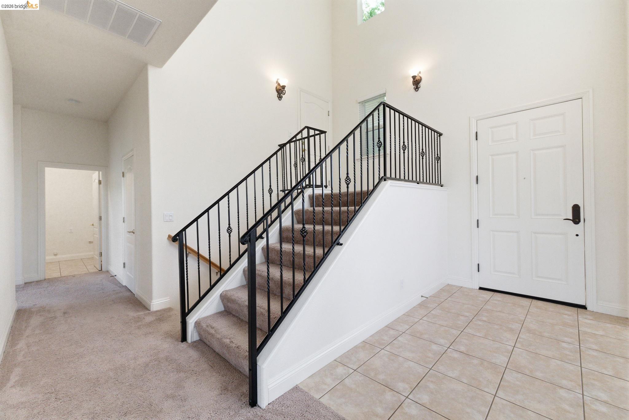 32 Apollo Lane Copperopolis, CA 95228 - Photo 20 of 58 Stairway featuring a high ceiling and tile patterned flooring