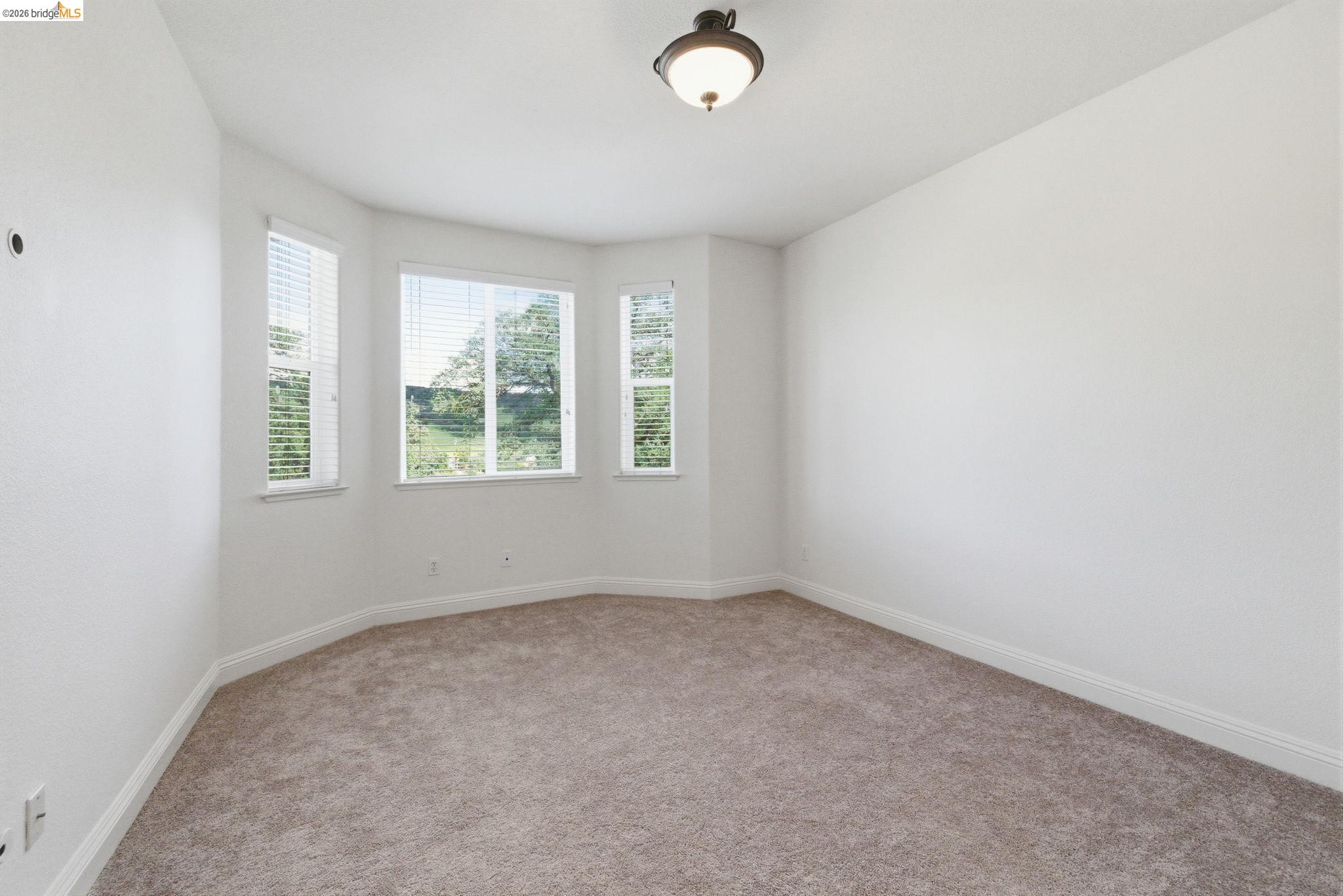 32 Apollo Lane Copperopolis, CA 95228 - Photo 39 of 58 Unfurnished room with light colored carpet and baseboards