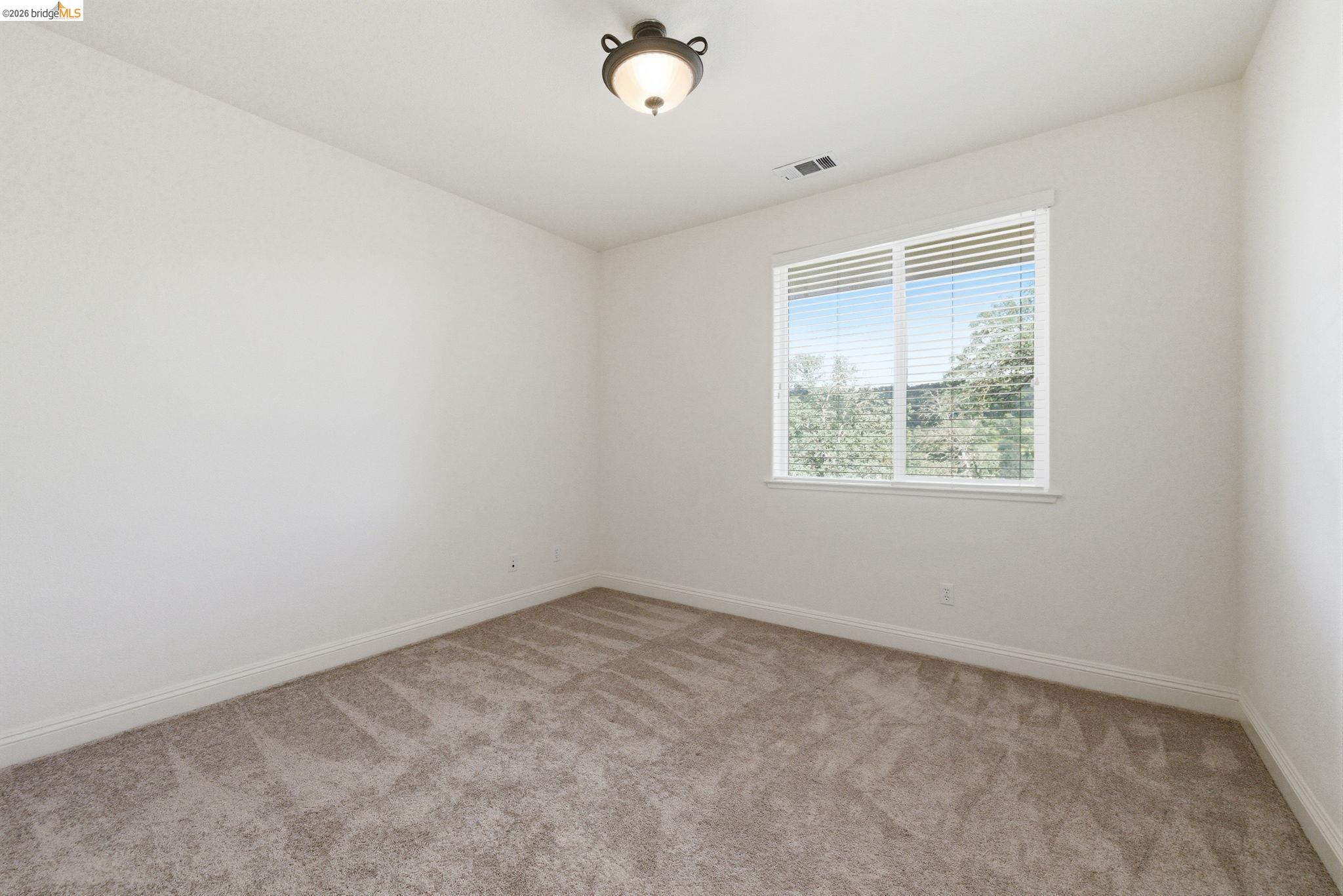 32 Apollo Lane Copperopolis, CA 95228 - Photo 42 of 58 Empty room with light colored carpet and baseboards