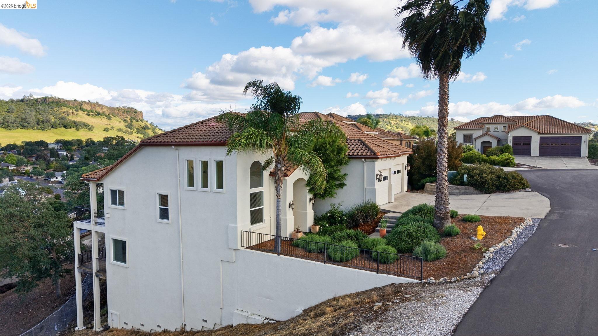 32 Apollo Lane Copperopolis, CA 95228 - Photo 49 of 58 View of side of property featuring stucco siding, a tiled roof, and driveway