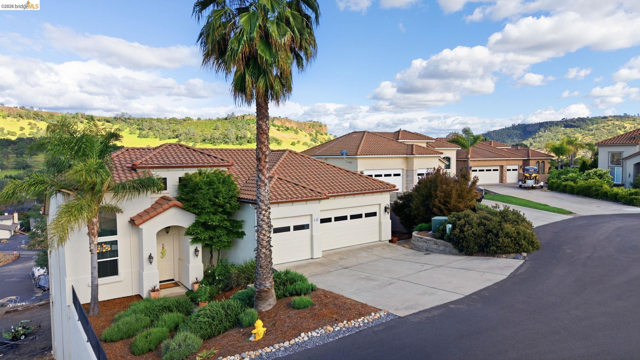 32 Apollo Lane Copperopolis, CA 95228 - Photo 50 of 58 Mediterranean / spanish-style house featuring stucco siding, concrete driveway, a garage, and a tiled roof
