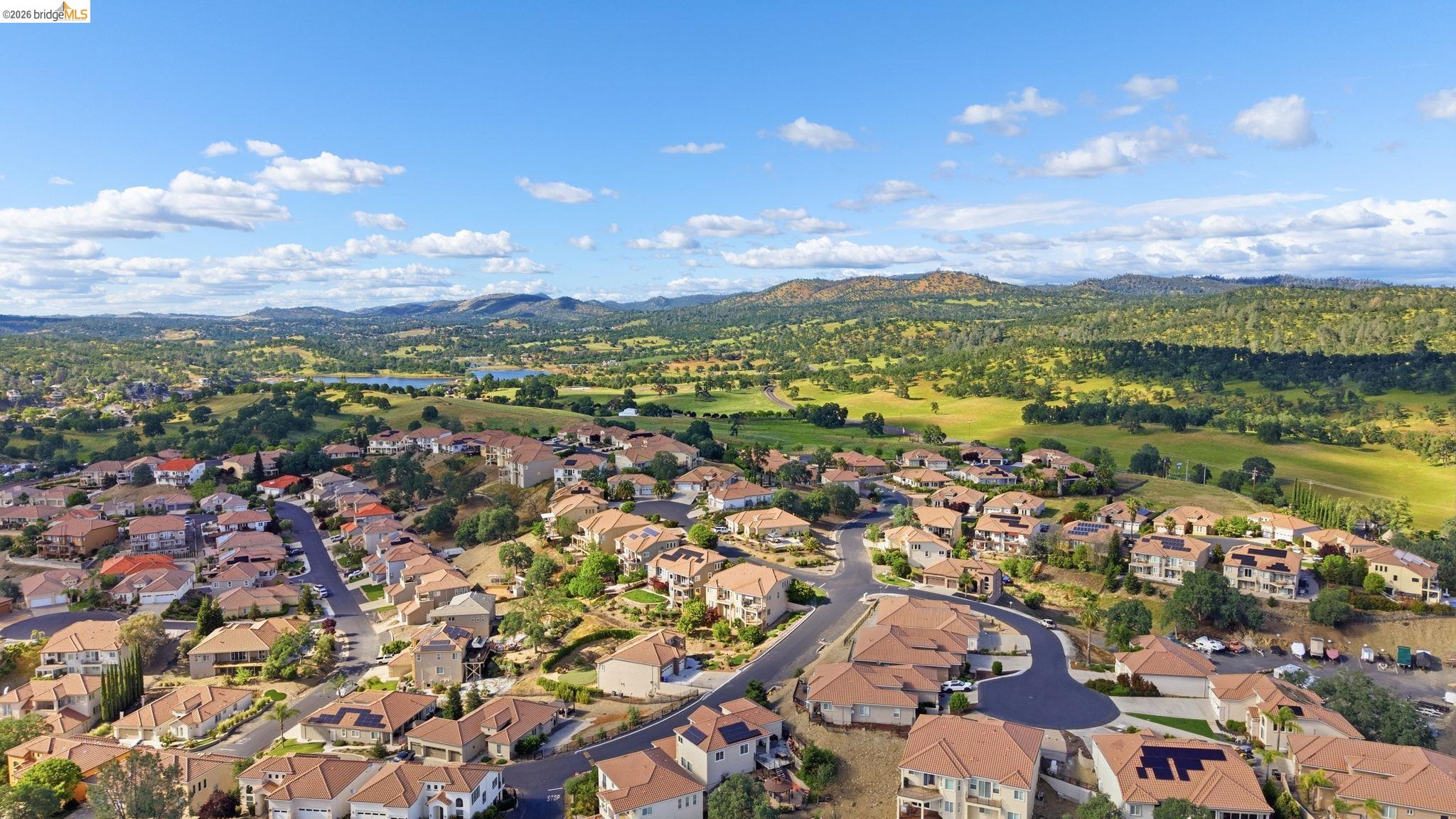 32 Apollo Lane Copperopolis, CA 95228 - Photo 56 of 58 Aerial view of residential area with a mountainous background