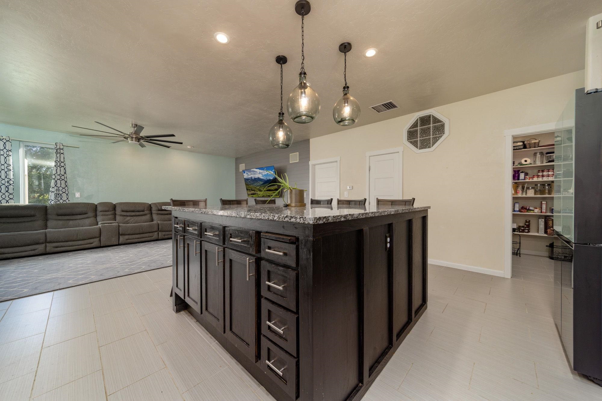 623 Sobre El Rio Drive Palisade, CO 81526 - Photo 12 of 28 a kitchen with stainless steel appliances granite countertop a sink and a stove