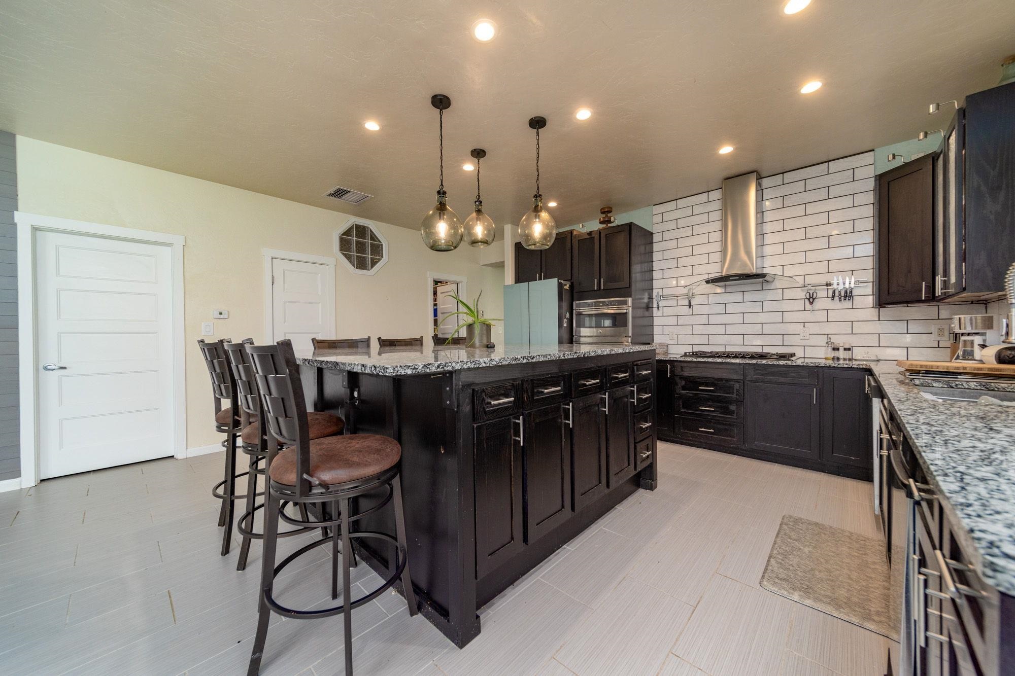 623 Sobre El Rio Drive Palisade, CO 81526 - Photo 13 of 28 a kitchen with a table and chairs in it
