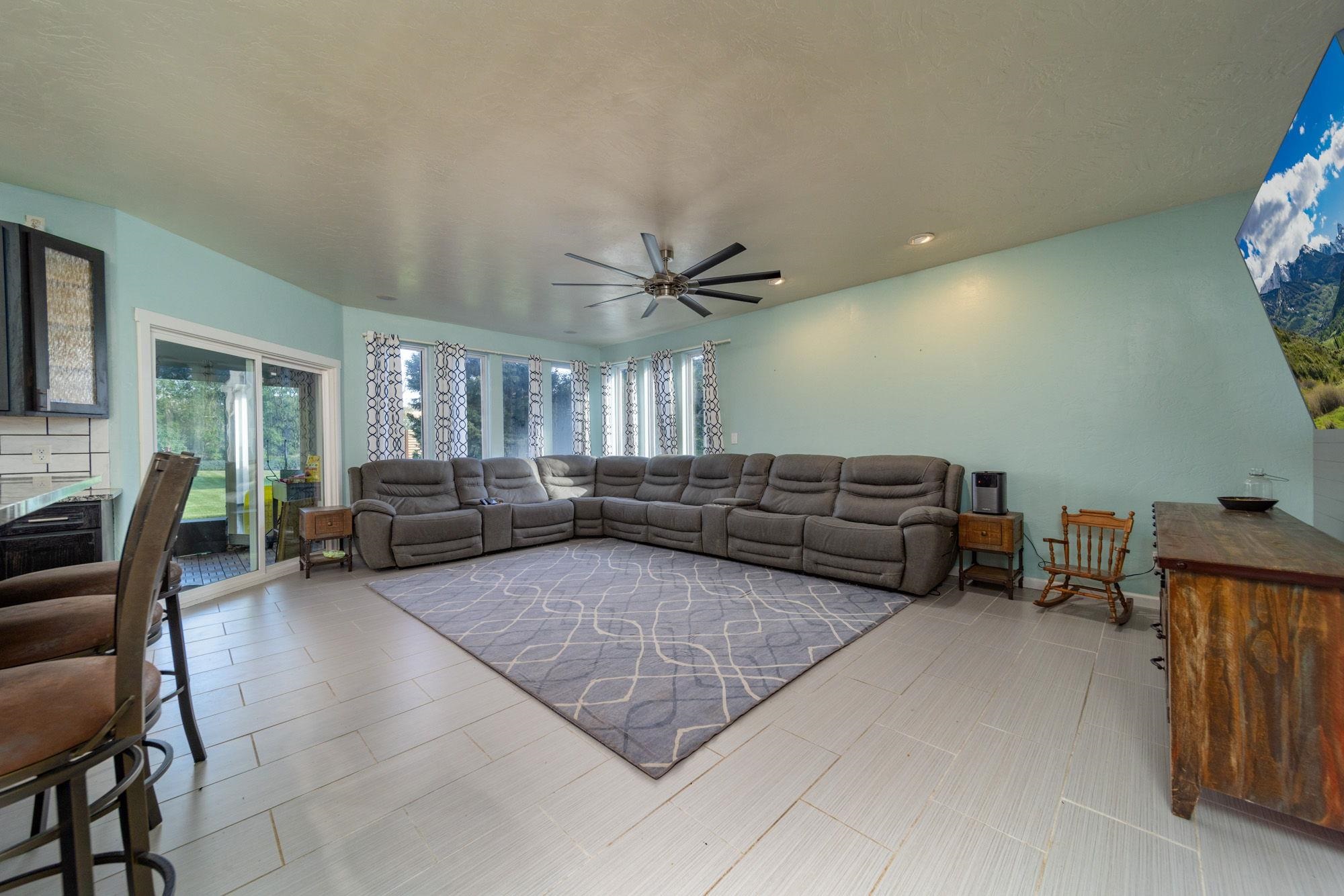 623 Sobre El Rio Drive Palisade, CO 81526 - Photo 15 of 28 a living room with lots of furniture and a window