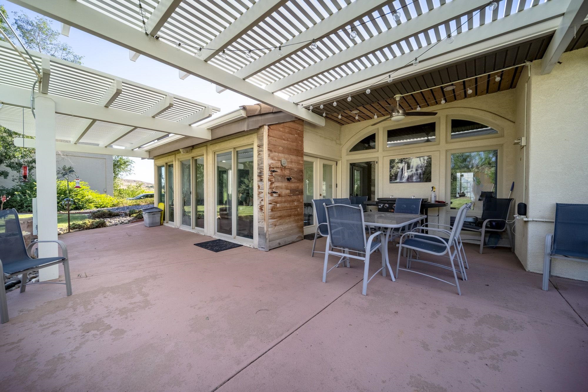 623 Sobre El Rio Drive Palisade, CO 81526 - Photo 22 of 28 a view of a porch with furniture and a backyard