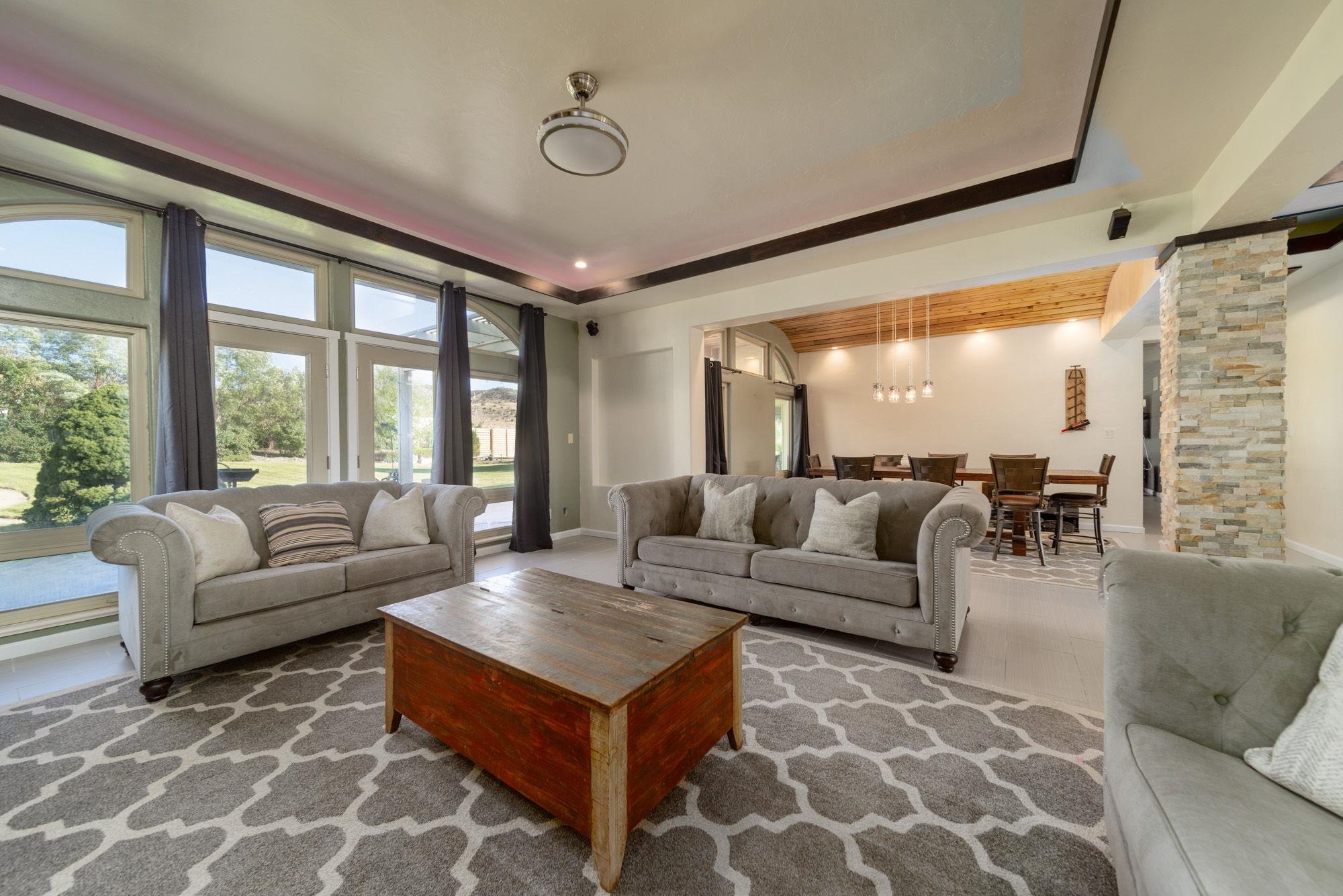 623 Sobre El Rio Drive Palisade, CO 81526 - Photo 4 of 28 a living room with furniture and a large window