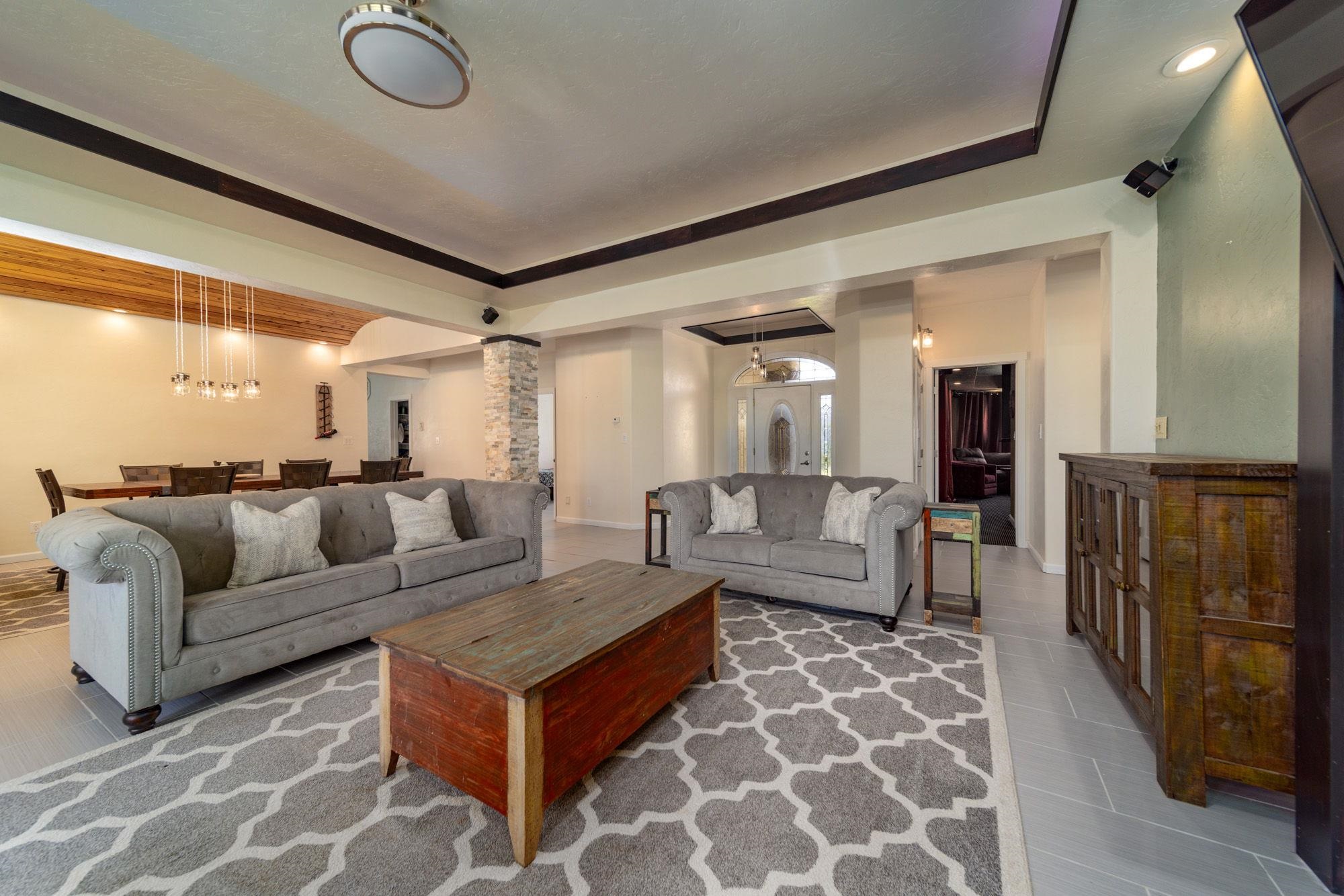 623 Sobre El Rio Drive Palisade, CO 81526 - Photo 5 of 28 a living room with furniture and a rug