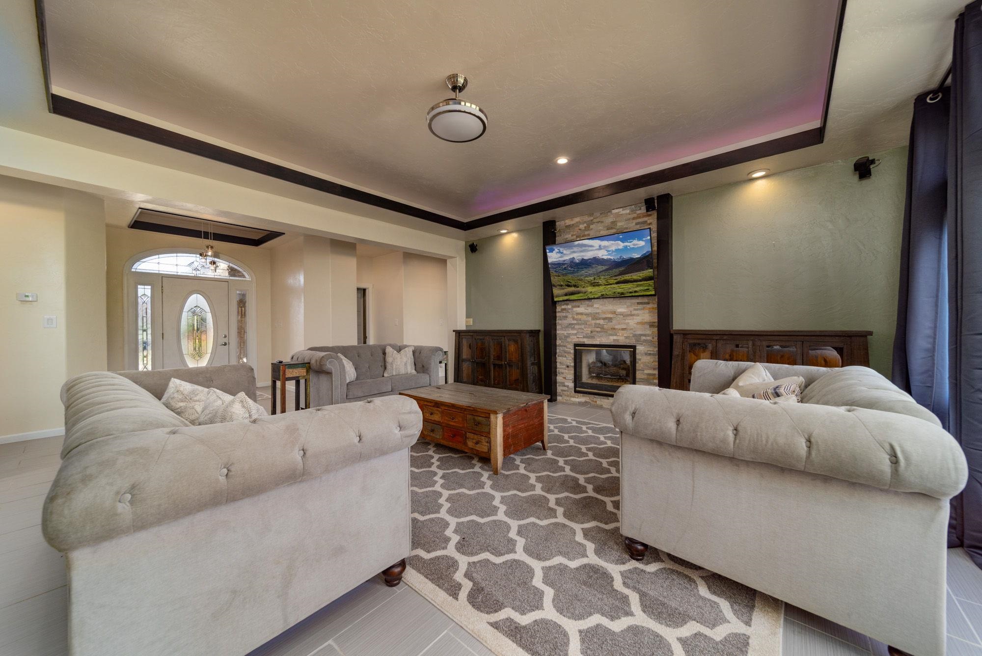 623 Sobre El Rio Drive Palisade, CO 81526 - Photo 6 of 28 a living room with furniture and a flat screen tv