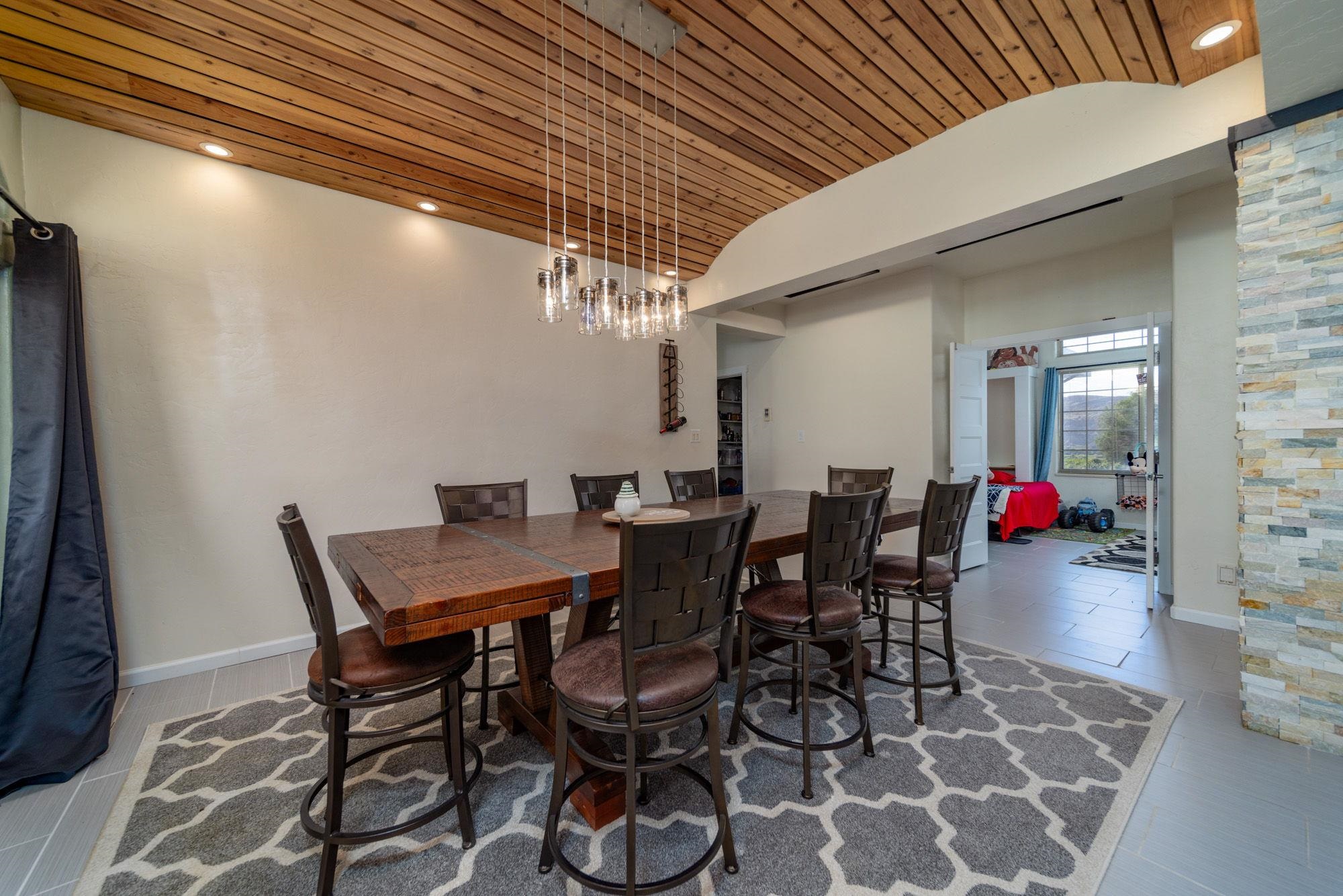 623 Sobre El Rio Drive Palisade, CO 81526 - Photo 7 of 28 a view of a dining room with furniture and wooden floor