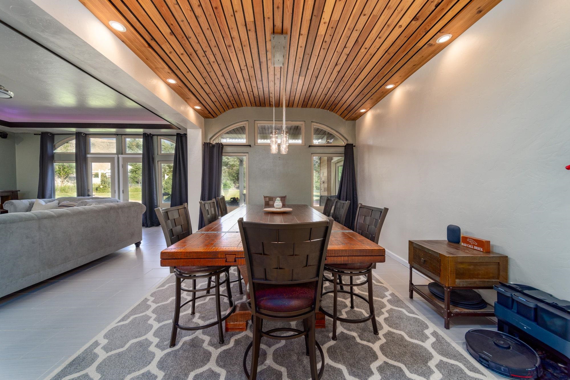 623 Sobre El Rio Drive Palisade, CO 81526 - Photo 8 of 28 a view of a dining room with furniture window and wooden floor