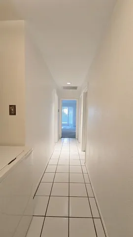 a view of an empty room and window