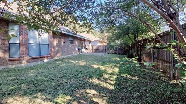 a backyard of a house with lots of green space