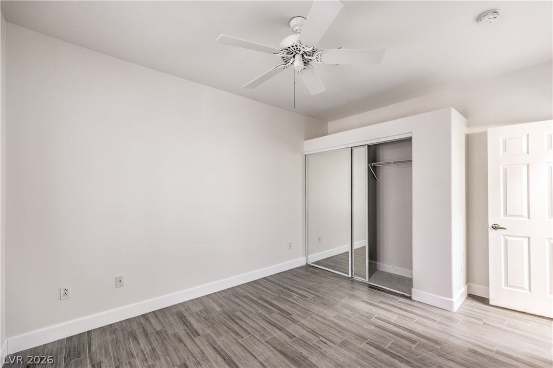 2050 West Warm Springs Road, Unit 1421 Henderson, NV 89014 - Photo 32 of 45 A well-lit bedroom features durable tile flooring and convenient mirrored closet doors.