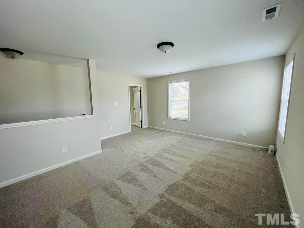 111 Tang Circle Garner, NC 27529 - Photo 11 of 16 a view of an empty room with a window