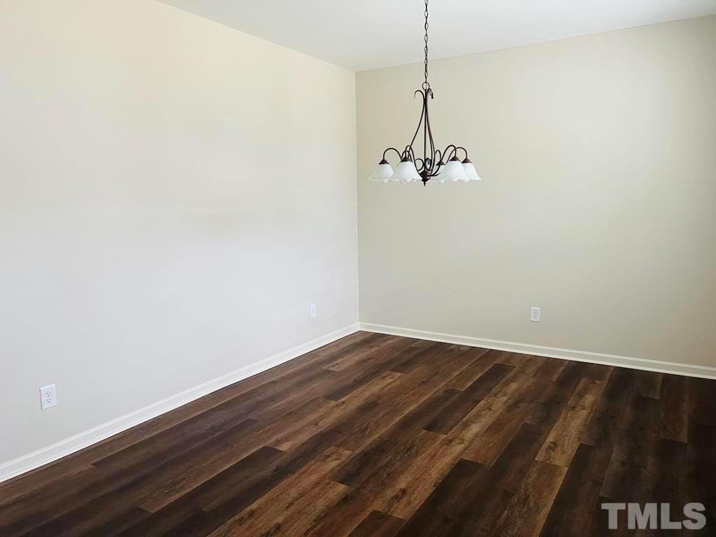 111 Tang Circle Garner, NC 27529 - Photo 16 of 16 a view of a room with wooden floor and windows