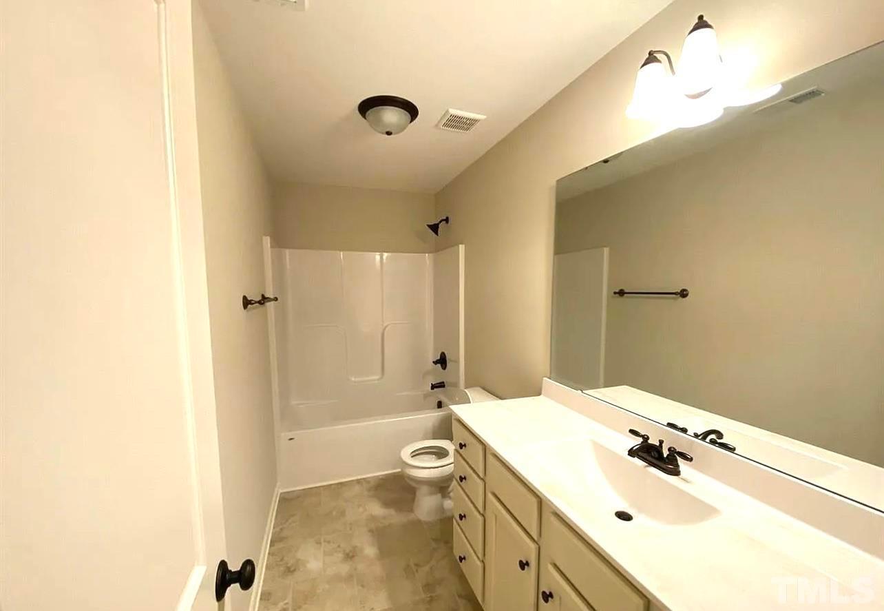 111 Tang Circle Garner, NC 27529 - Photo 6 of 16 a bathroom with a sink a toilet and shower