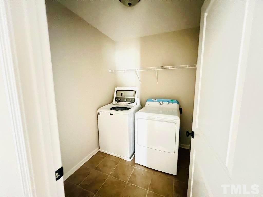 111 Tang Circle Garner, NC 27529 - Photo 10 of 16 a utility room with dryer and washer