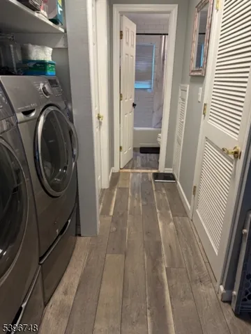 a view of a hallway with washer and dryer