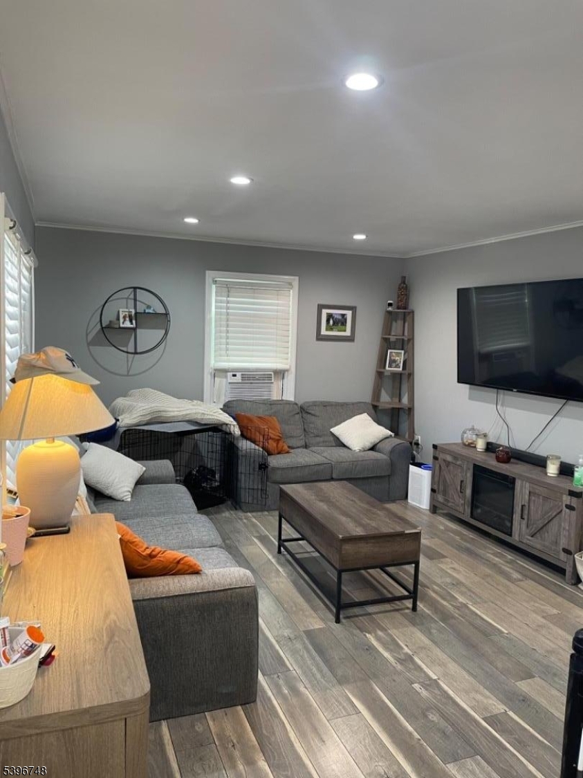 16 Brookside Avenue Pequannock, NJ 07444 - Photo 2 of 30 a living room with furniture and a flat screen tv
