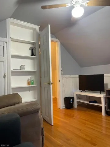 a living room with a flat screen tv and a fireplace