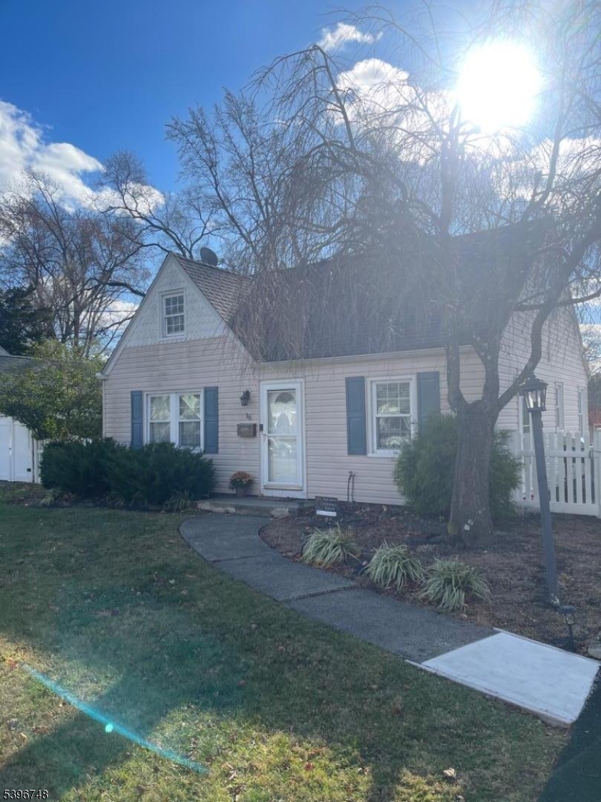 16 Brookside Avenue Pequannock, NJ 07444 - Photo 25 of 30 a front view of a house with garden