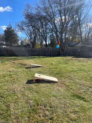 a view of a swimming pool with an outdoor space and seating area