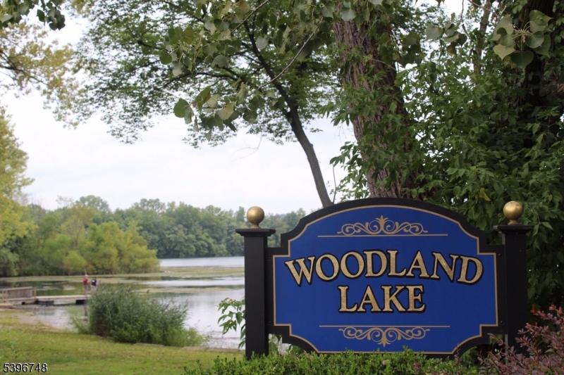 16 Brookside Avenue Pequannock, NJ 07444 - Photo 29 of 30 a sign of golf club on a wall under a tree