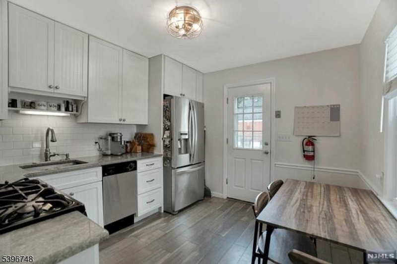 16 Brookside Avenue Pequannock, NJ 07444 - Photo 3 of 30 a kitchen with a refrigerator and a stove top oven