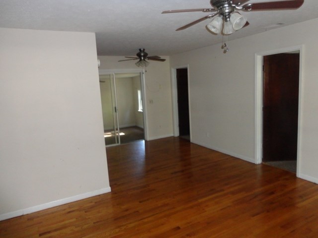 5227 Burbank Street Columbus, GA 31907 - Photo 2 of 8 wooden floor in an empty room