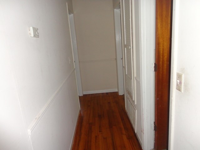 5227 Burbank Street Columbus, GA 31907 - Photo 3 of 8 a view of a hallway with wooden floor