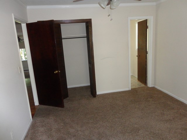 5227 Burbank Street Columbus, GA 31907 - Photo 5 of 8 an empty room with closet and door