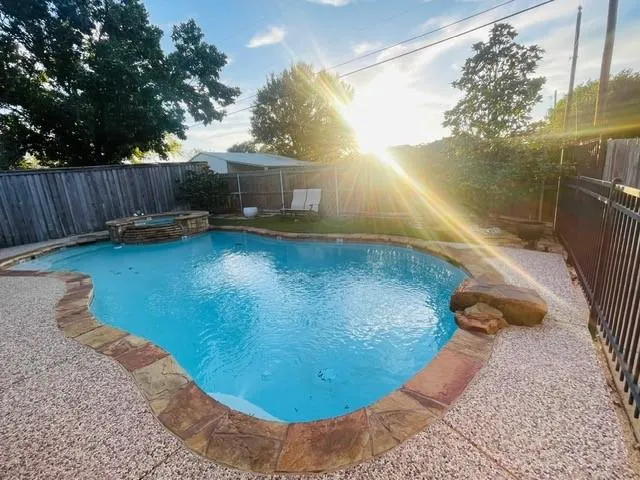 a view of a backyard with sitting area