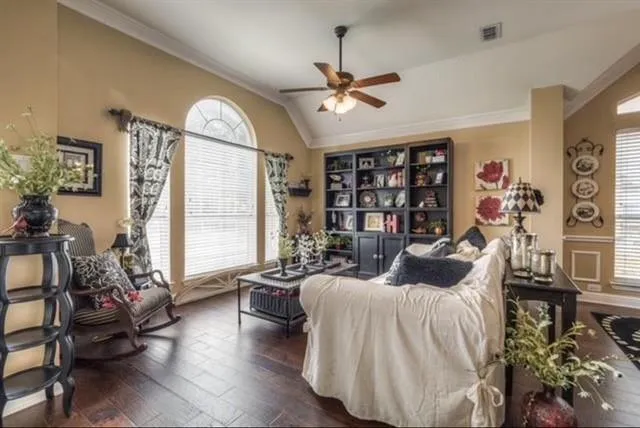 a bedroom with furniture and a large window